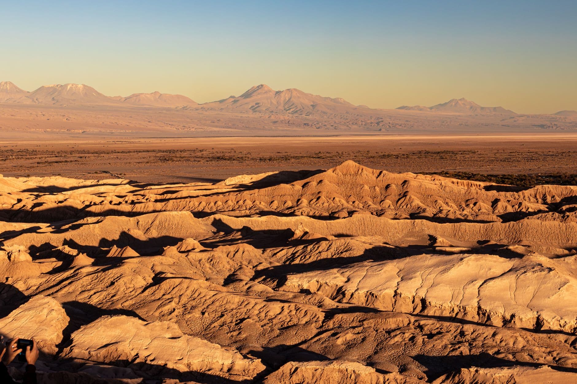 Stunning landscape of Atacama Desert with golden hues at sunset. Perfect for travel and nature lovers.