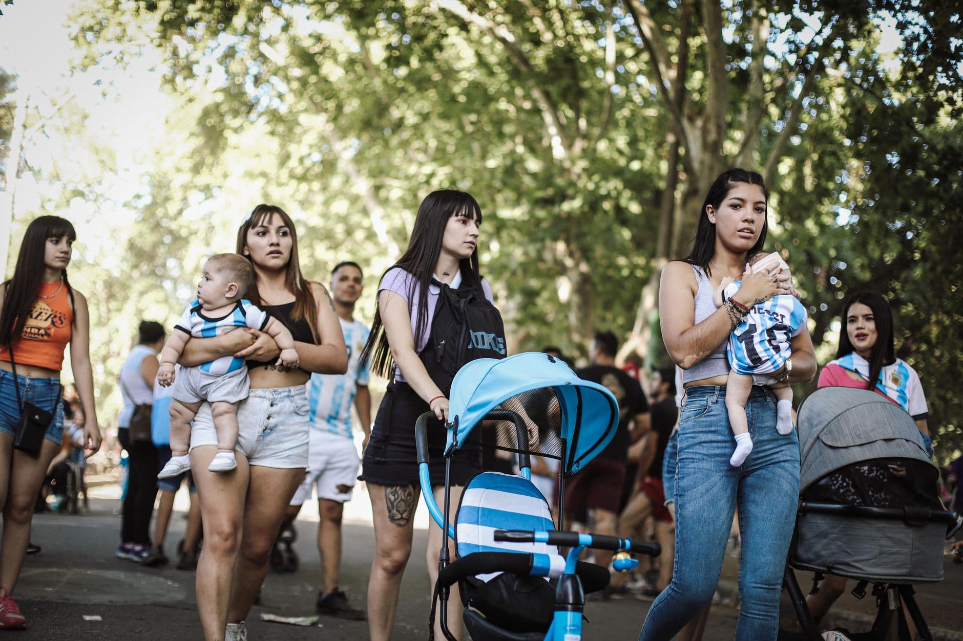 Groups gather outdoors in Buenos Aires, embracing festive community spirit.